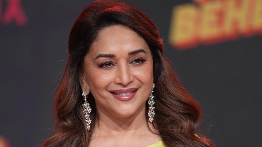 Madhuri Dixit says society still judges women differently than men..