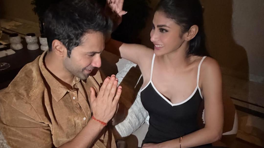 Varun Dhawan takes blessing from his on screen 'Maa' Mouni Roy..
